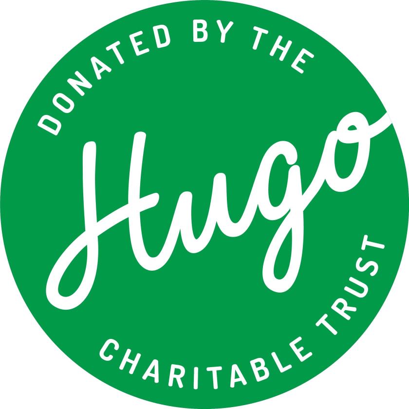 Circular stamp picture that reads 'donated by the Hugo Charitable Trust'